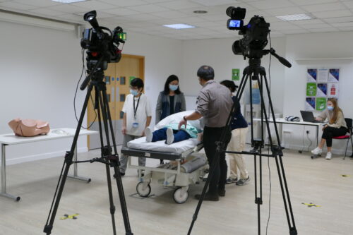 Filming educational training videos for healthcare staff.