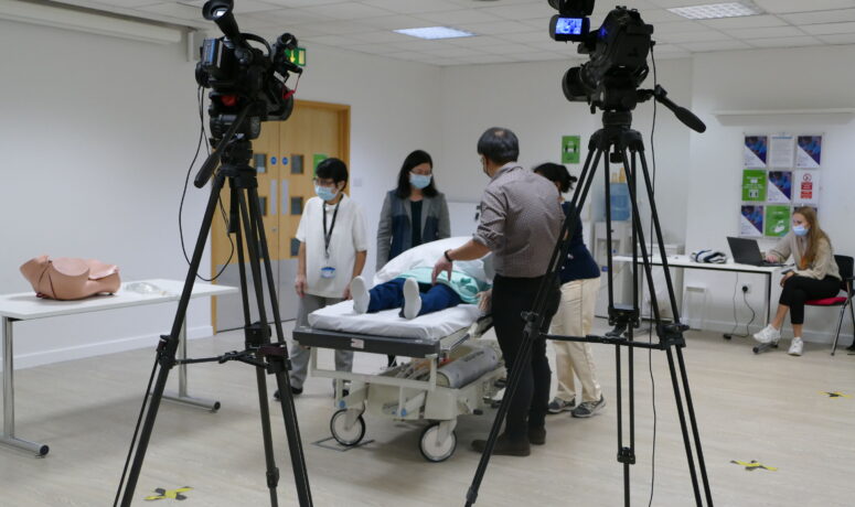 Filming educational training videos for healthcare staff.