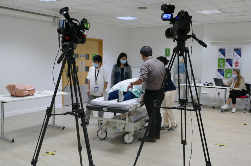 Filming educational training videos for healthcare staff.